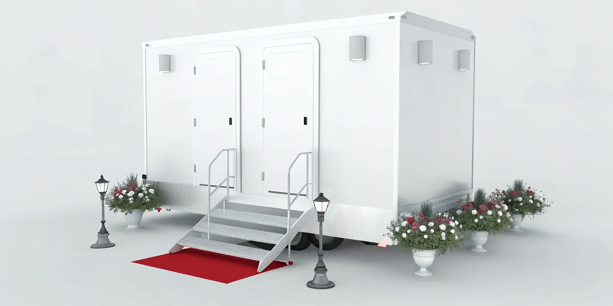 A 4 stall restroom trailer rental for a wedding with elegant steps, red carpet, and floral decor.