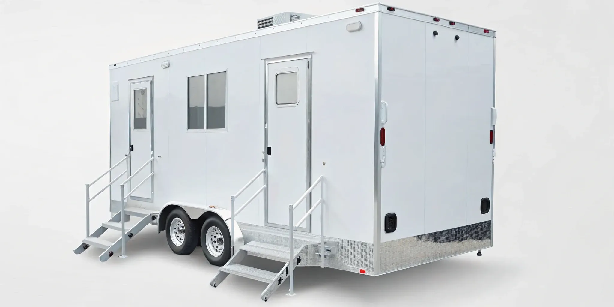 ADA restroom trailer with air conditioning and an accessible entry ramp.