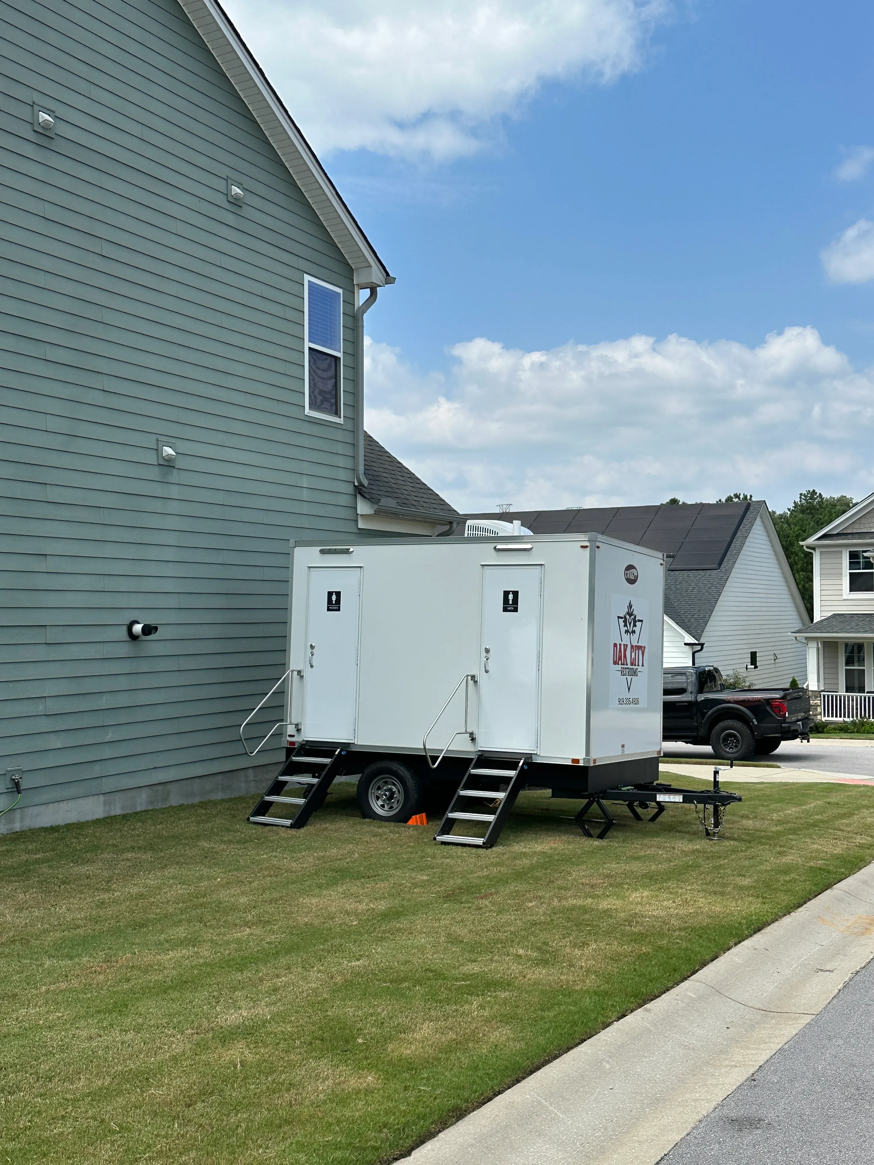 Restroom Trailer set up next to house for a private event