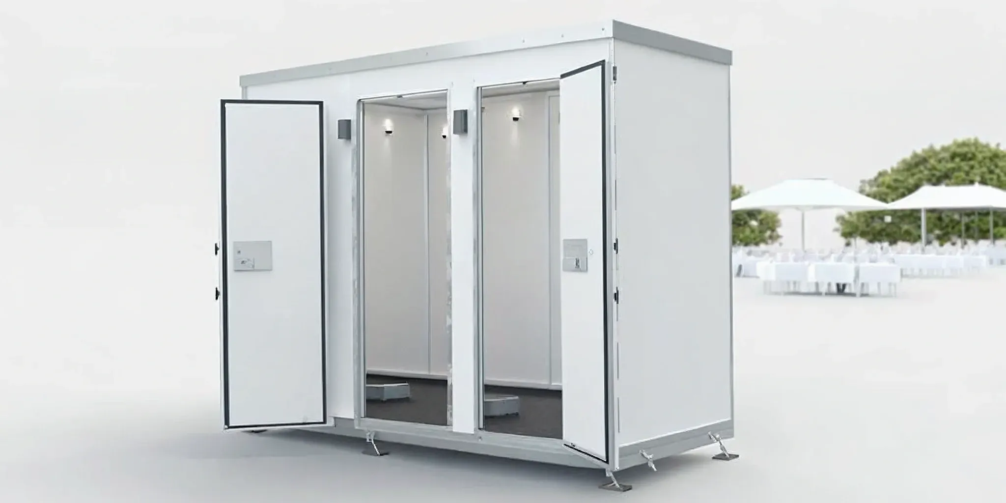 ADA compliant portable bathroom with an accessible ramp at an outdoor corporate event.